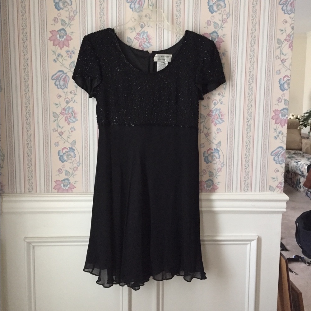 Black beaded knee length evening dress
